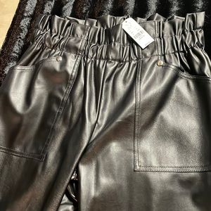 Faux black leather cinch sack waistband. High wasted adorable pants.